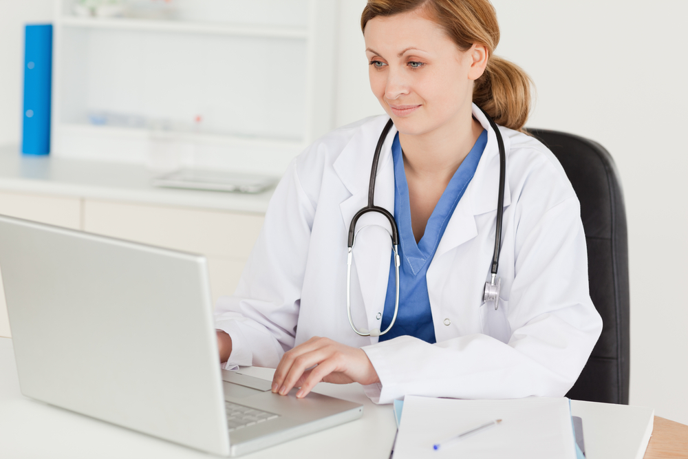Female doctor on laptop