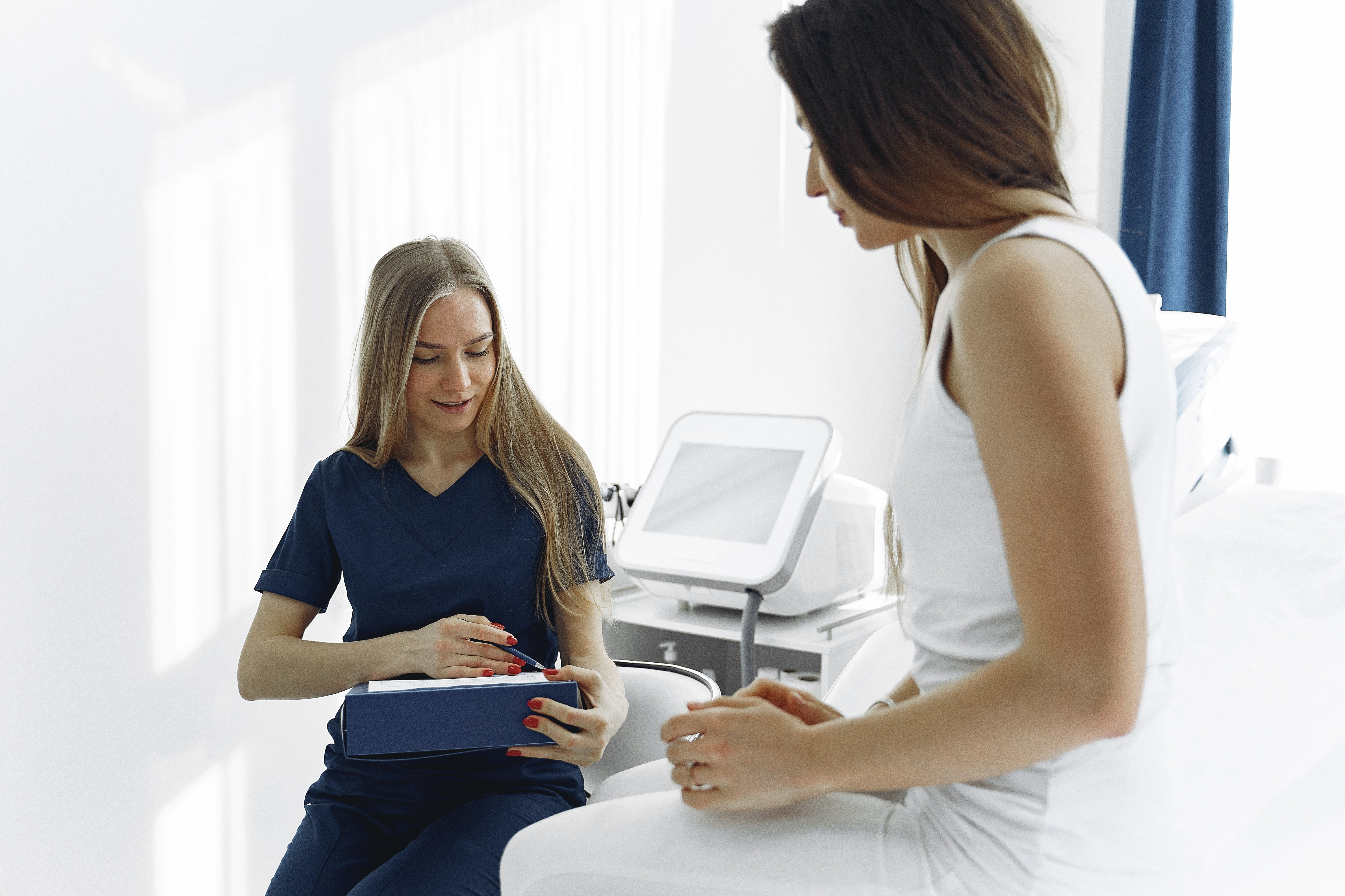 female doctor working with female patient